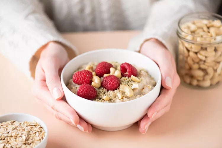 High-fiber foods including whole grains, fruits, vegetables, beans, nuts, seeds, and avocado for daily gut health